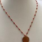 Collier perle rouge